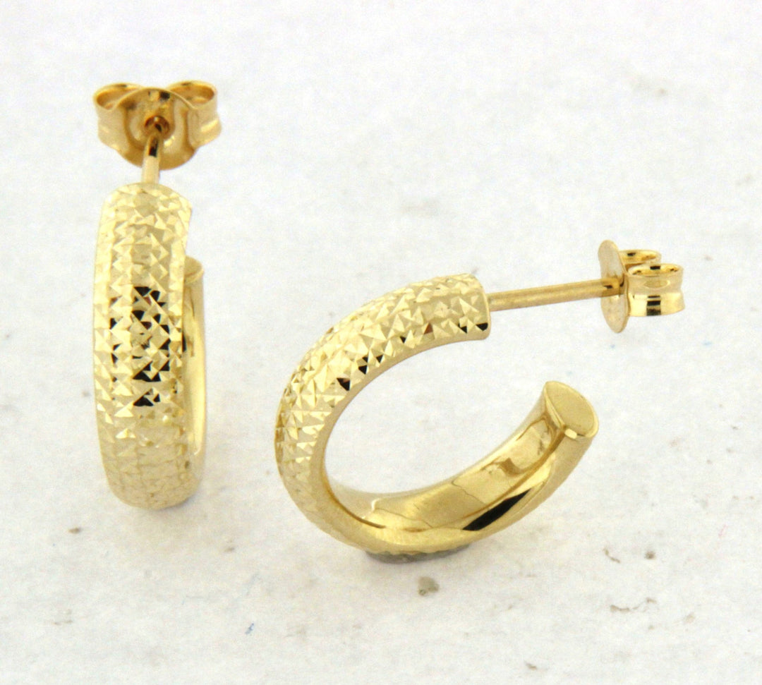 Elegant 10K yellow gold hoop earrings with a unique textured design, providing a sophisticated and stylish appearance that enhances any jewelry collection.