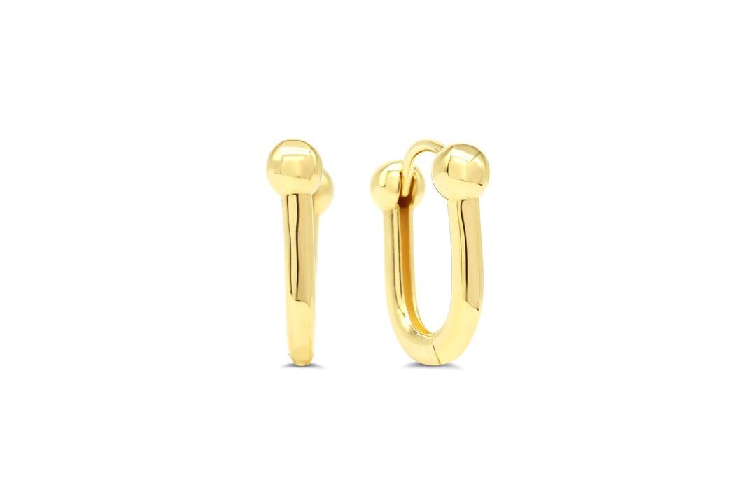 Polished 10K yellow gold hoop earrings with a unique ball tip detail, offering a blend of classic style and modern elegance.