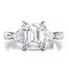 Exquisite 8x6mm Emerald-Cut Moissanite Three-Stone Ring with Tapered Band and Trapezoid Side Stones