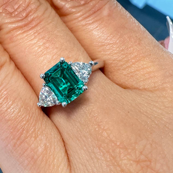 Lab-grown emerald ring with moissanite accents set in 14K white gold.