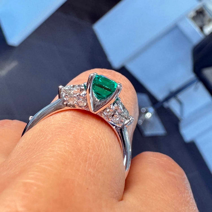 Lab-grown emerald ring with moissanite accents set in 14K white gold.