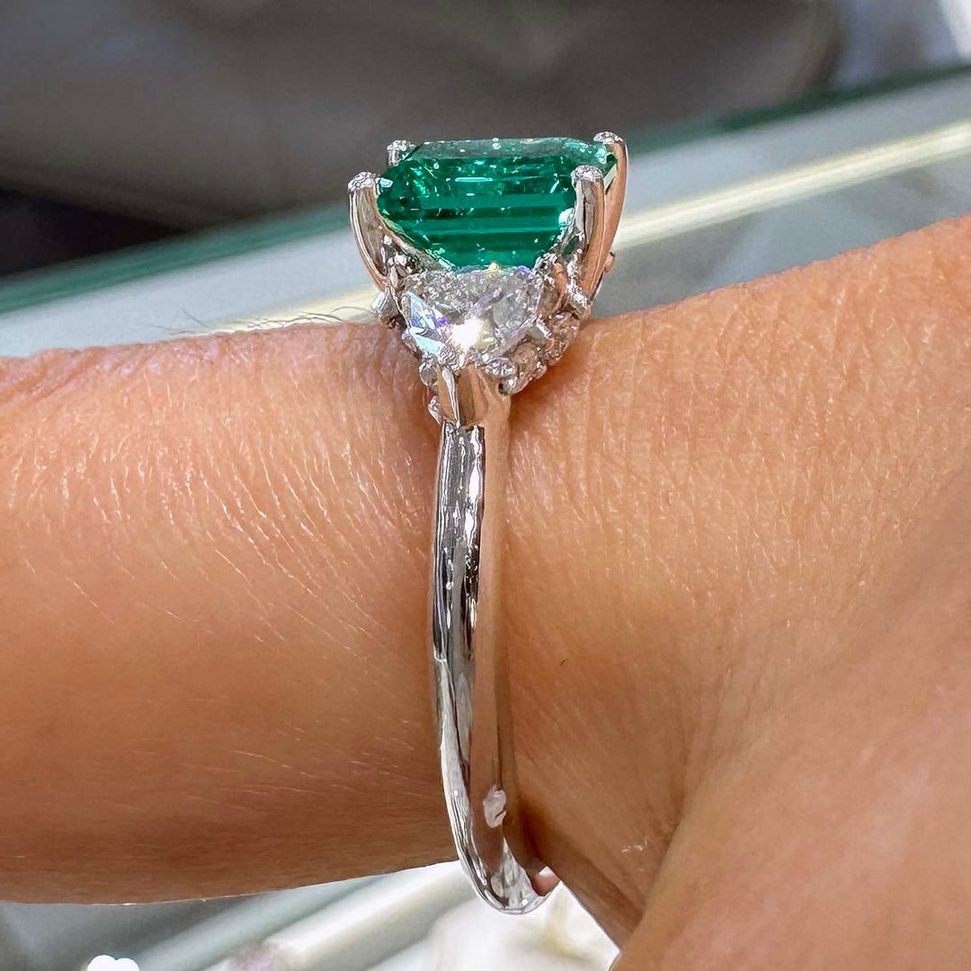 Lab-grown emerald ring with moissanite accents set in 14K white gold.