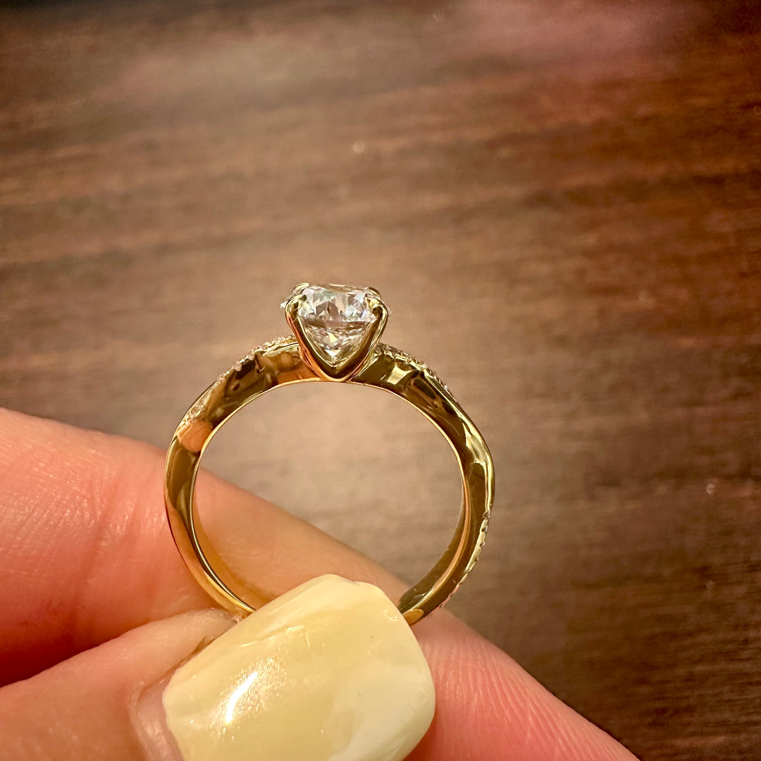 Lab grown diamond ring with 1 carat round center stone and accent diamonds in gold setting