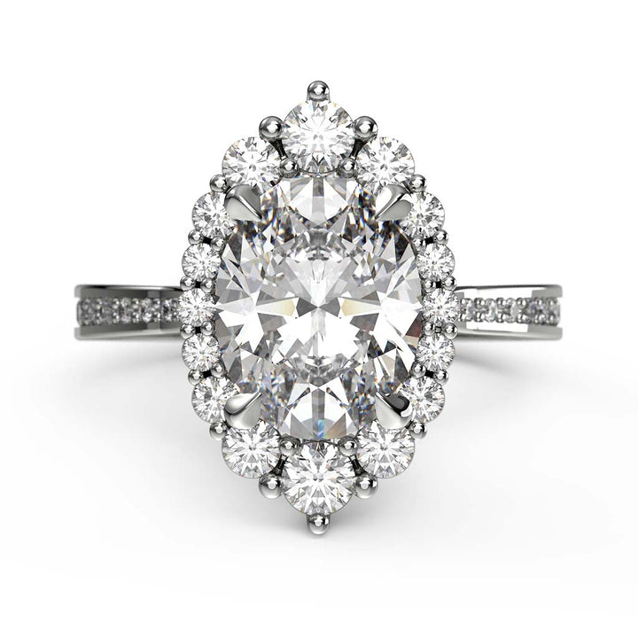 2CT oval moissanite halo engagement ring with pavé band in 14K gold.