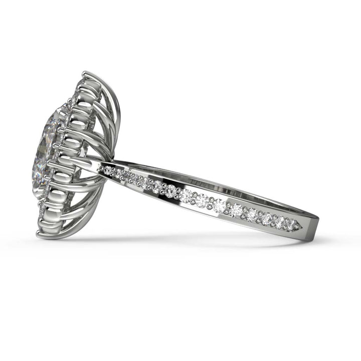 2CT oval moissanite halo engagement ring with pavé band in 14K gold.