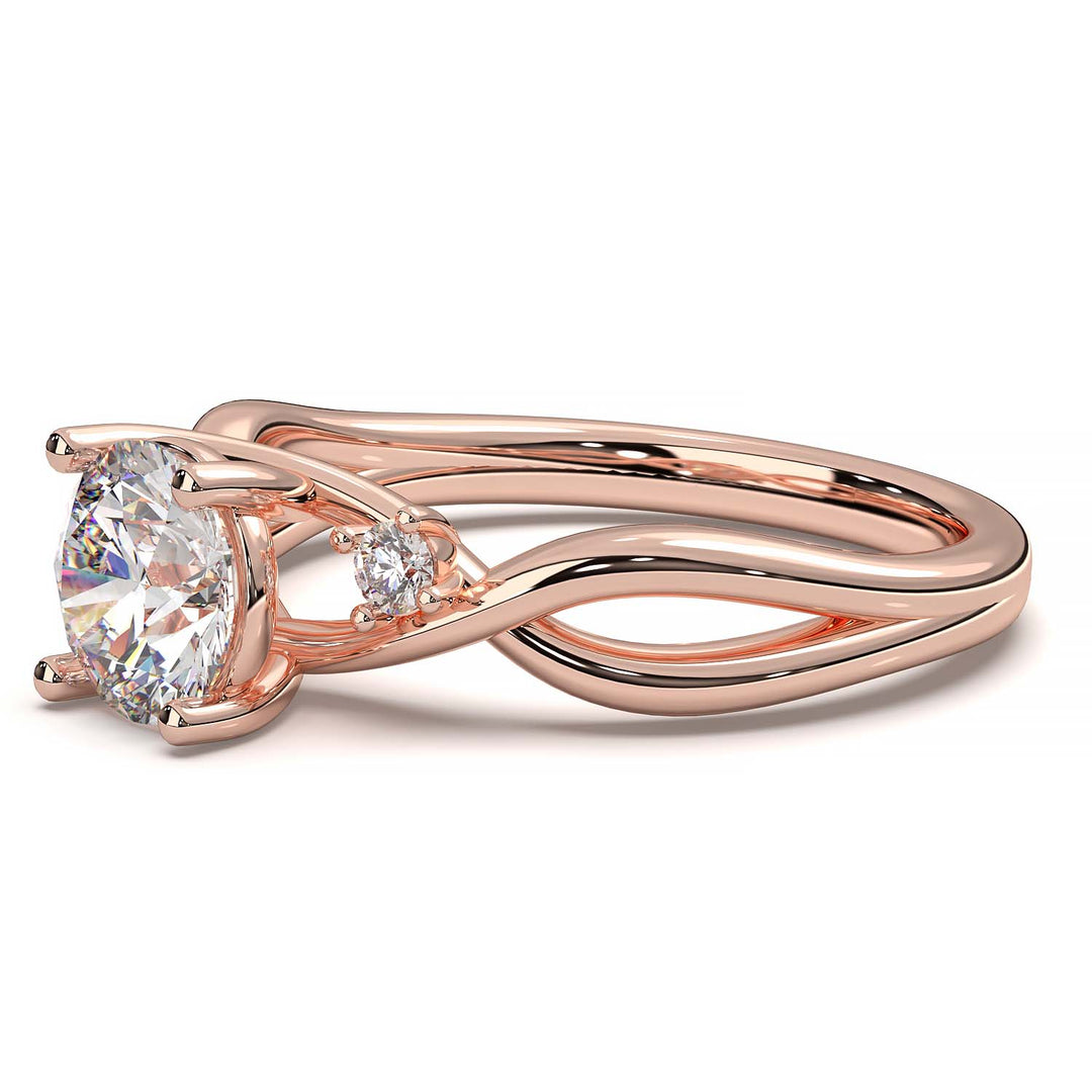 twisted engagement ring with a 0.8 carat round lab-grown diamond and two side lab-grown diamonds.