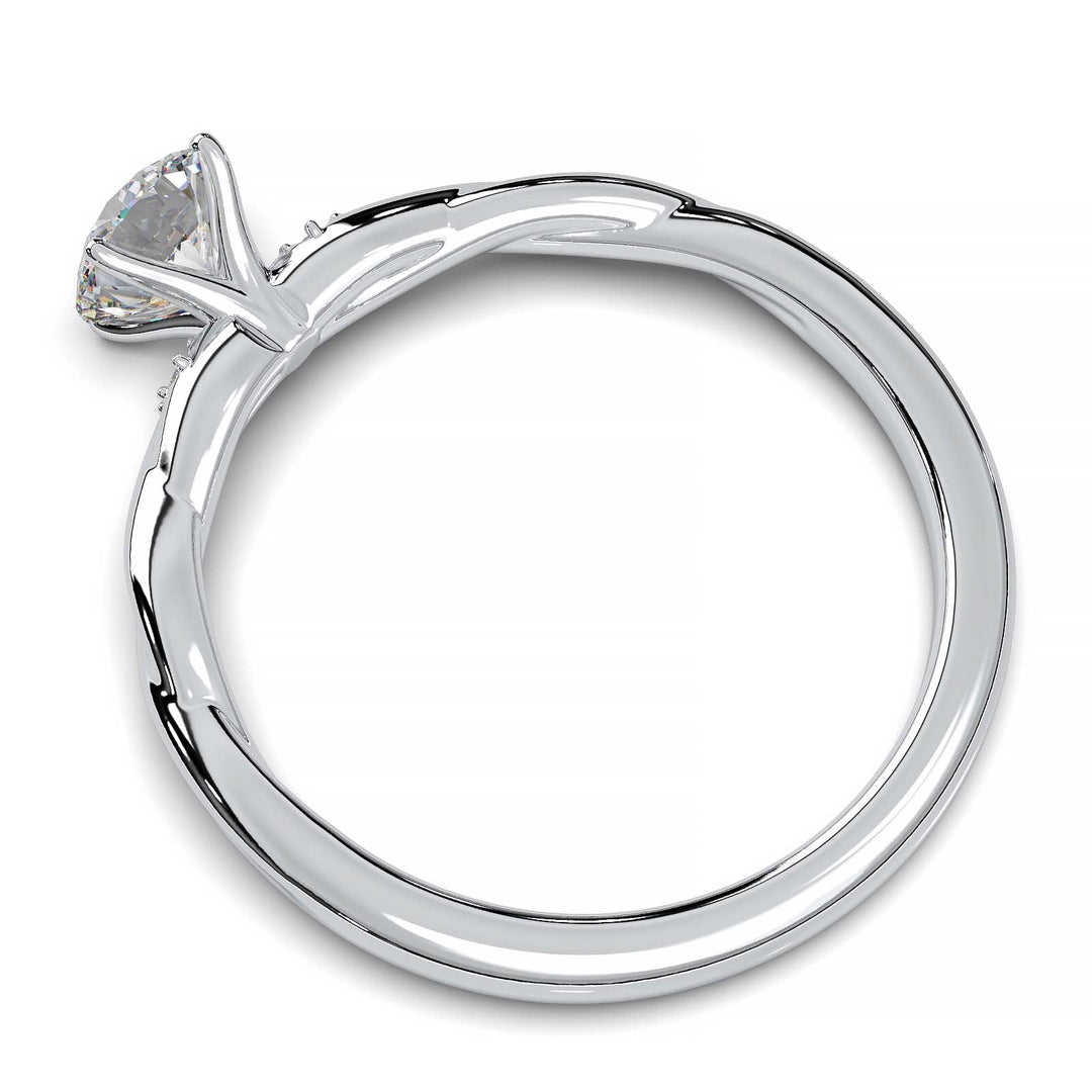 Twisted solitaire engagement ring with a large center diamond and two smaller side diamonds.