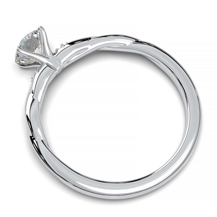 Twisted solitaire engagement ring with a large center diamond and two smaller side diamonds.