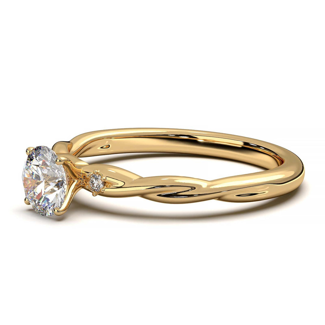 Twisted solitaire engagement ring with a large center diamond and two smaller side diamonds.