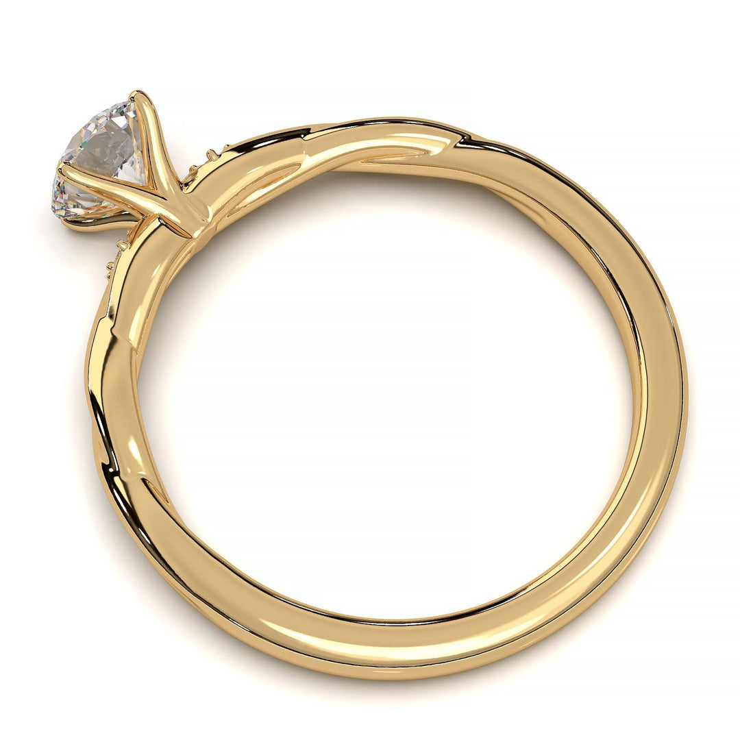 Twisted solitaire engagement ring with a large center diamond and two smaller side diamonds.