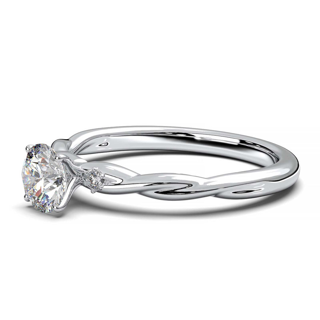 Twisted solitaire engagement ring with a large center diamond and two smaller side diamonds.