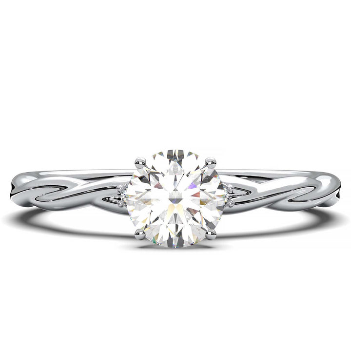 Twisted solitaire engagement ring with a large center diamond and two smaller side diamonds.