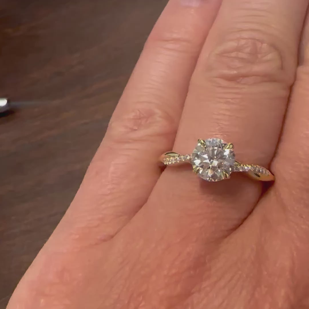 Lab grown diamond ring with 1 carat round center stone and accent diamonds in gold setting