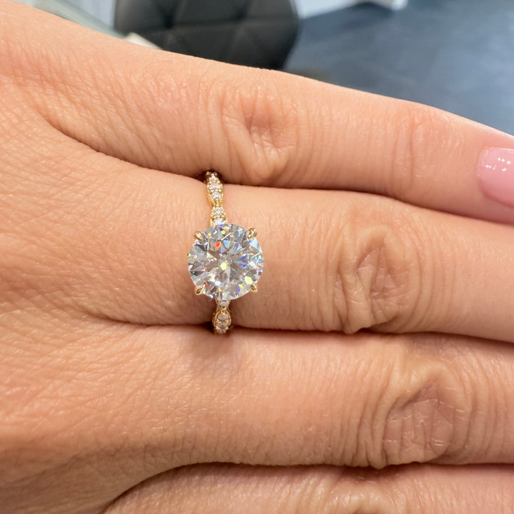 1.3 Ct round moissanite engagement ring with hidden halo in 14K gold.
