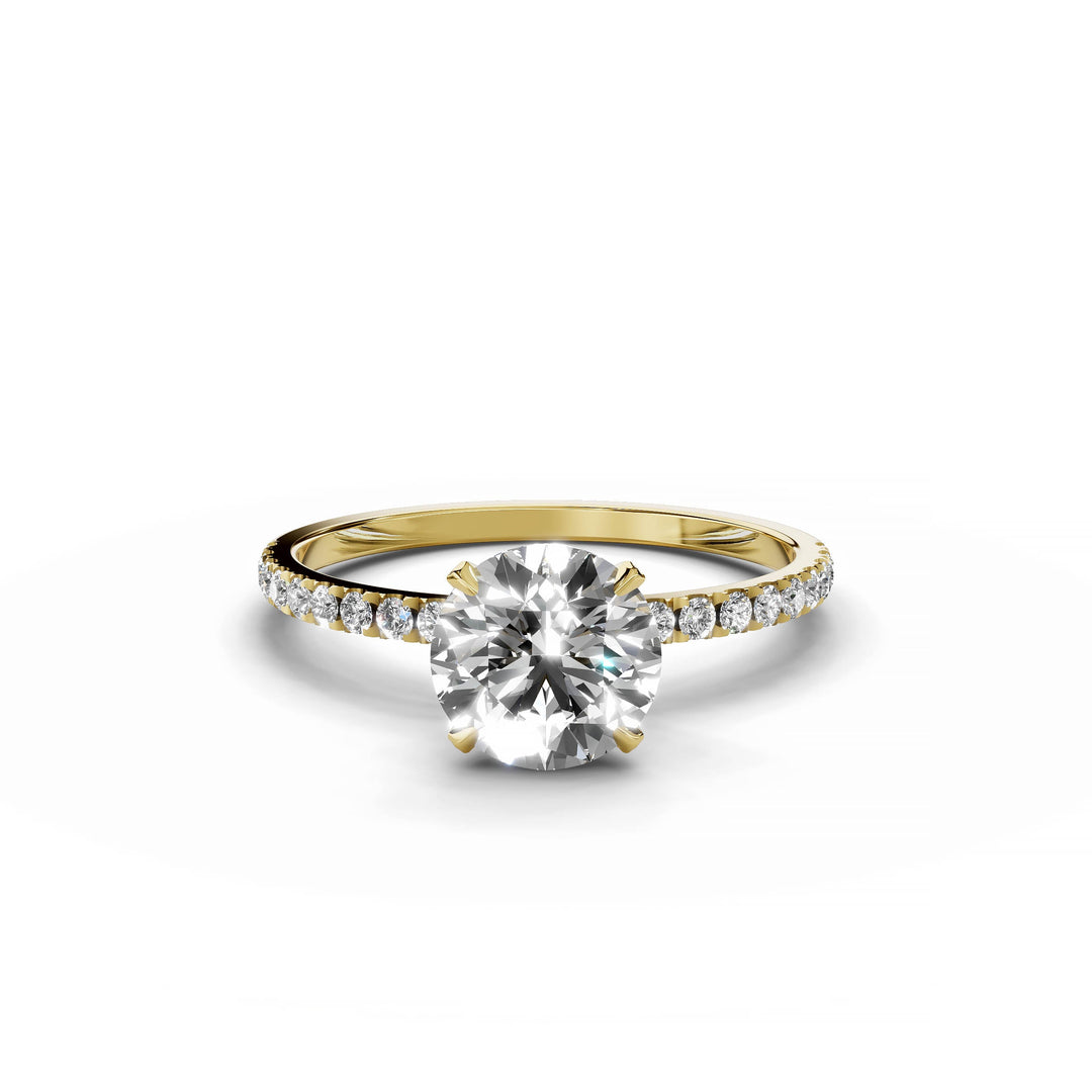Round diamond pavé engagement ring in yellow gold.