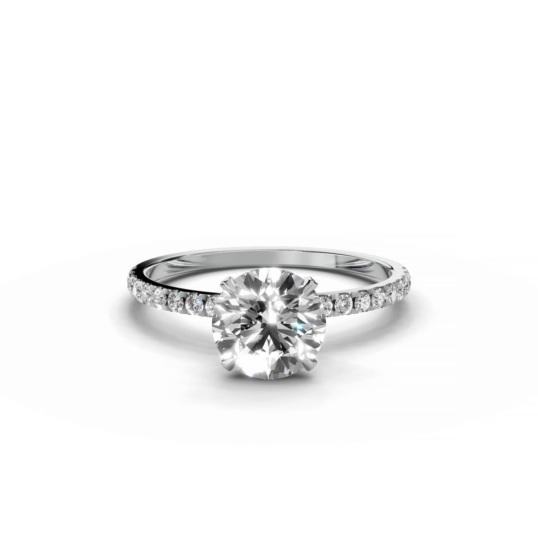 Round diamond pavé engagement ring in white gold.