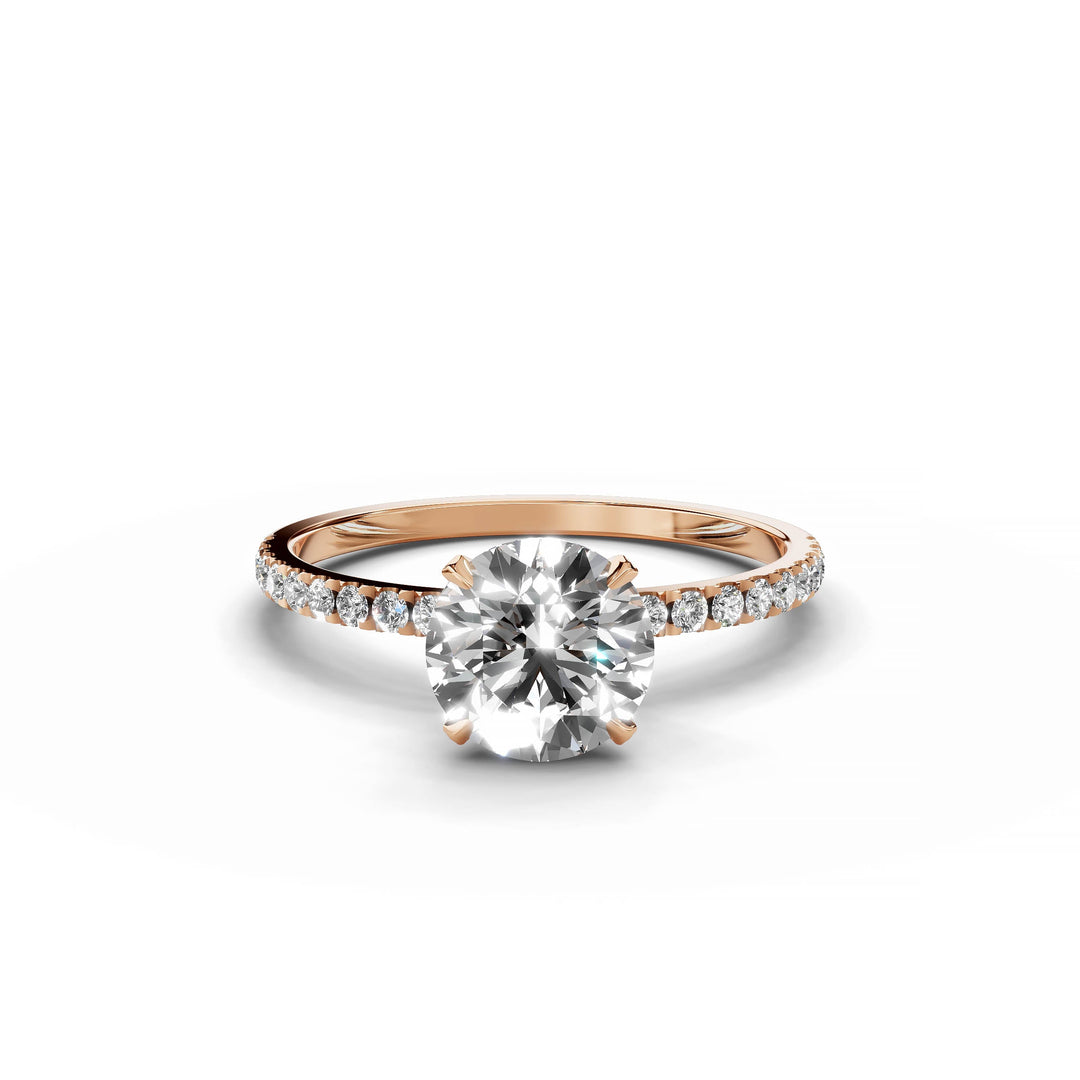 Round diamond Pavé engagement ring in rose gold.