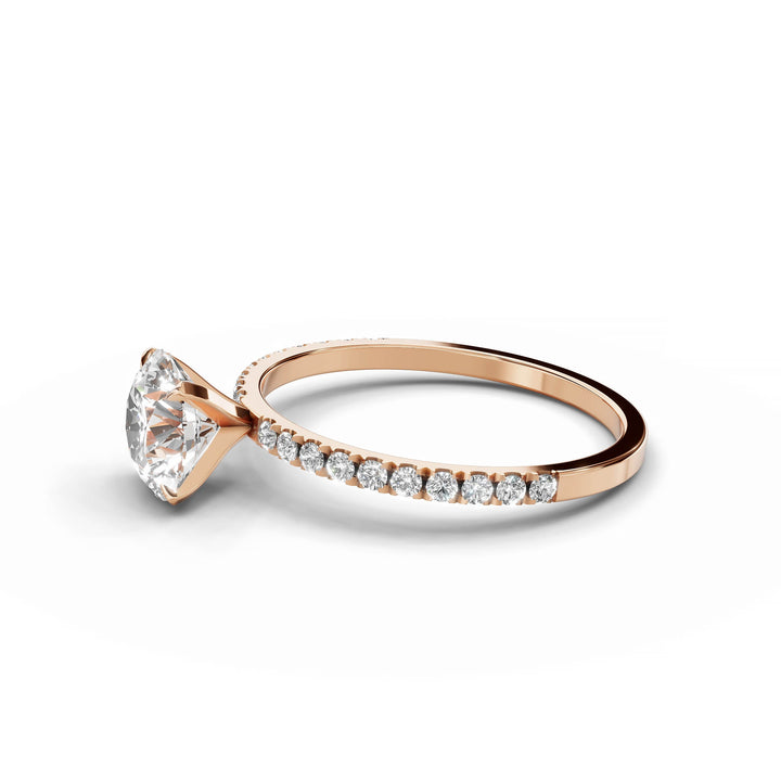 Round diamond Pavé engagement ring in rose gold.