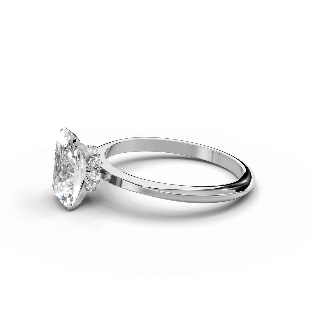Radiant diamond engagement ring with hidden halo in white gold.
