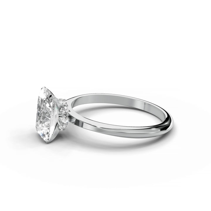 Radiant diamond engagement ring with hidden halo in white gold.