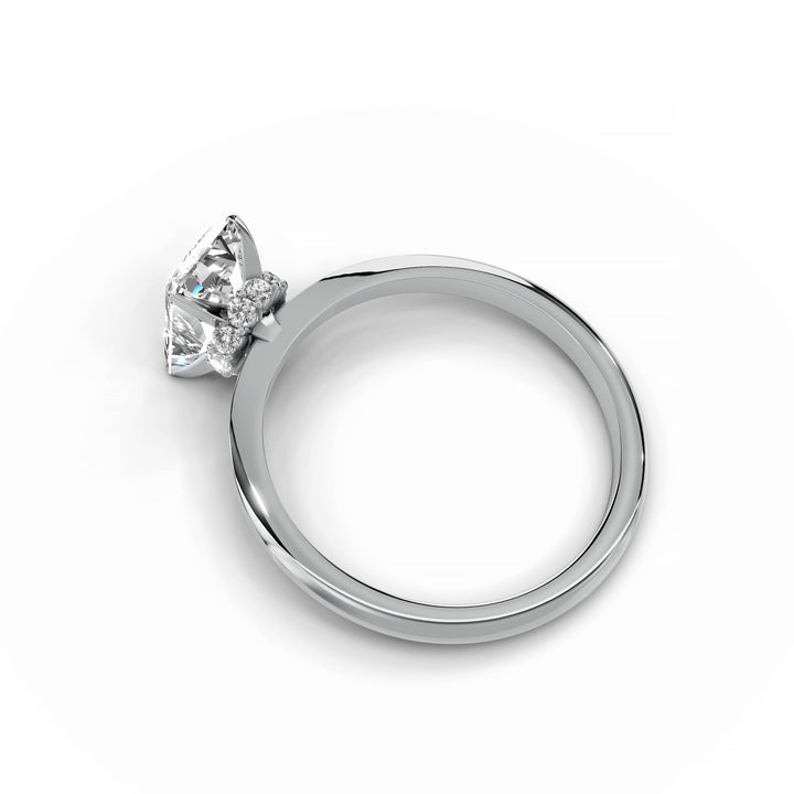 Radiant diamond engagement ring with hidden halo in white gold.
