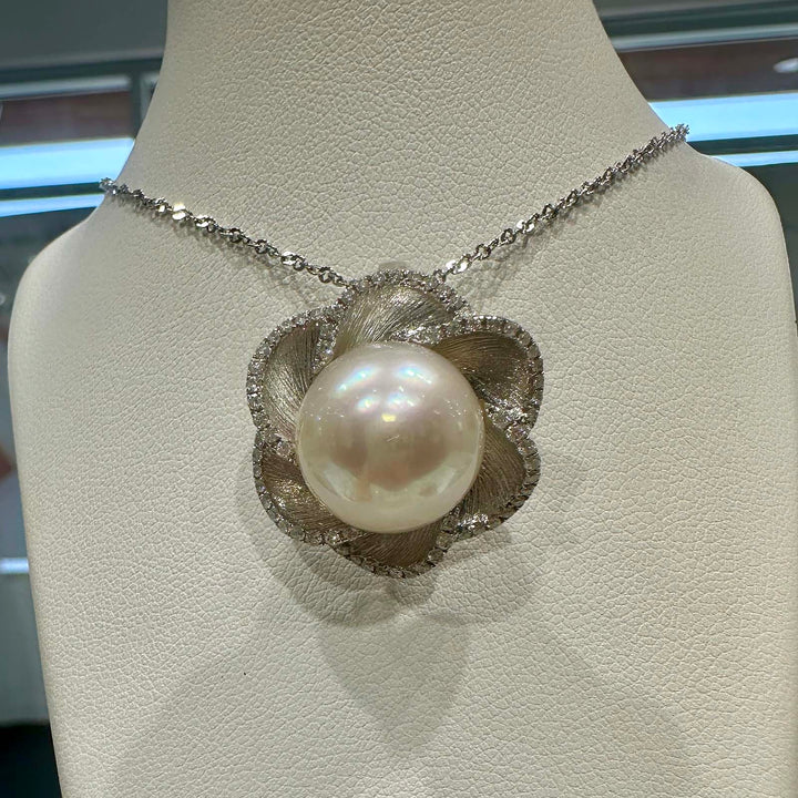 South Sea white pearl flower pendant with light rose cream overtone, 13.9mm round pearl set in 18K white gold with small diamonds.
