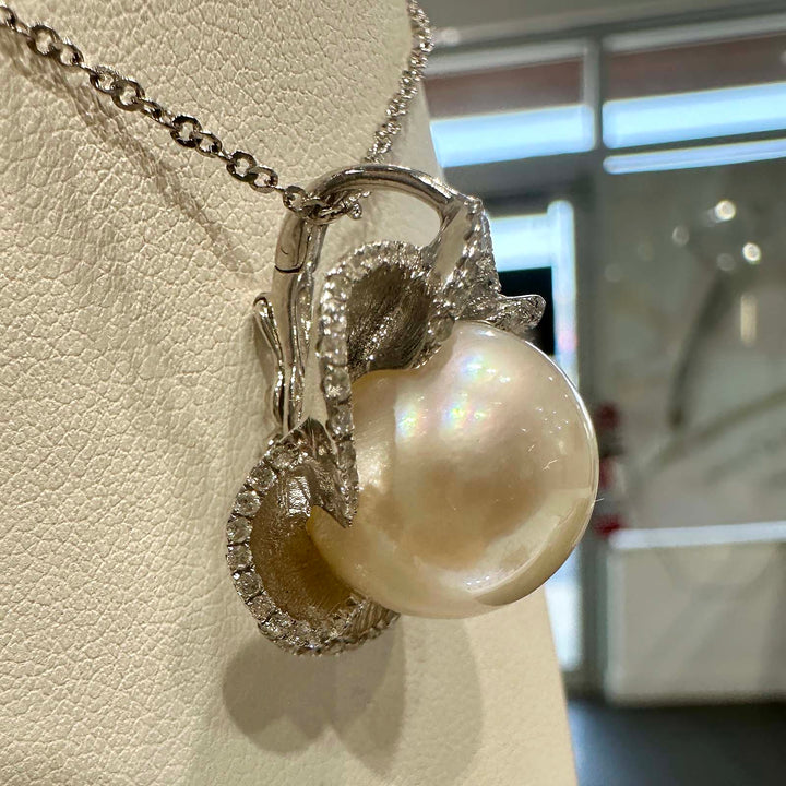 South Sea white pearl flower pendant with light rose cream overtone, 13.9mm round pearl set in 18K white gold with small diamonds.
