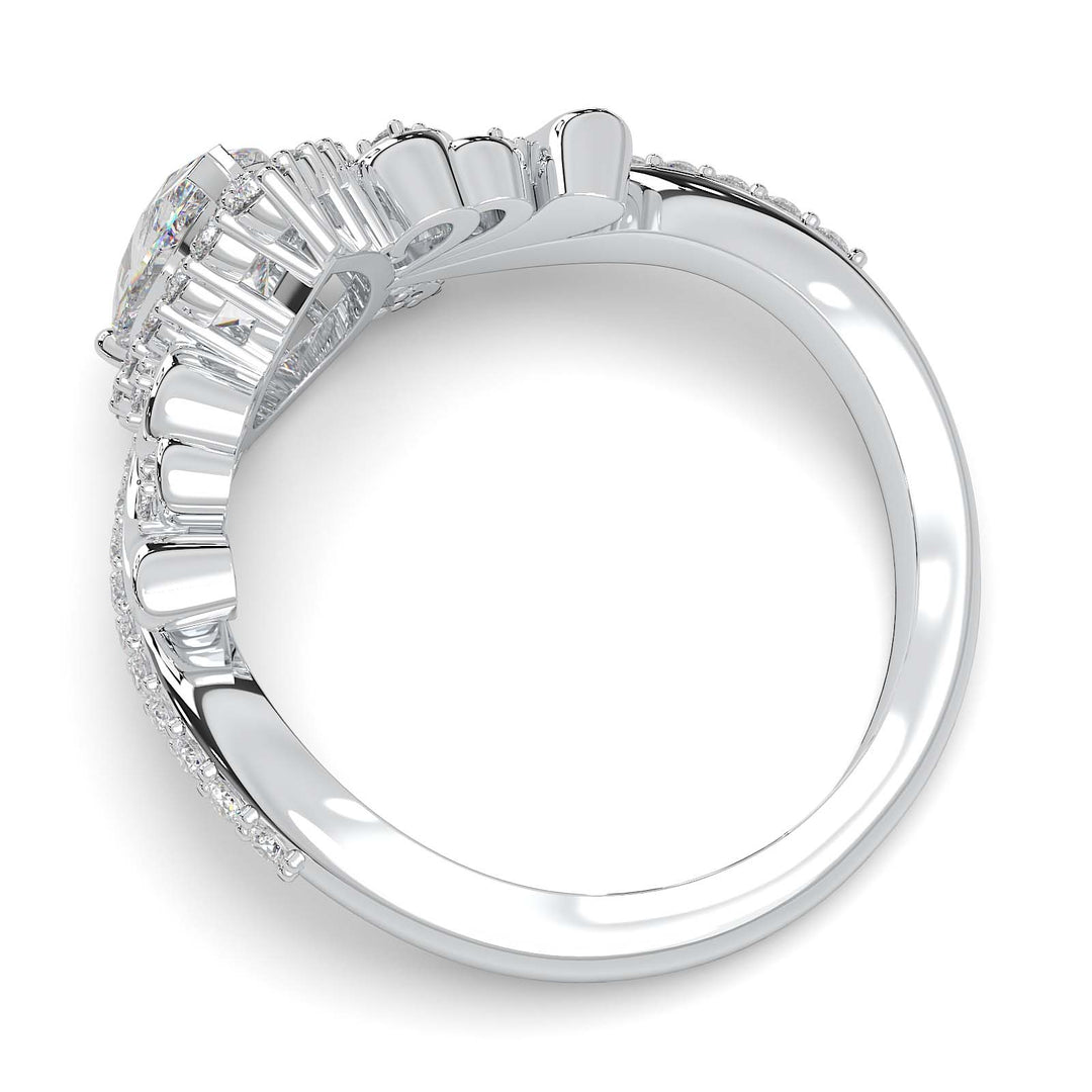 Pear-shaped diamond vintage engagement ring with custom prongs and halo design.