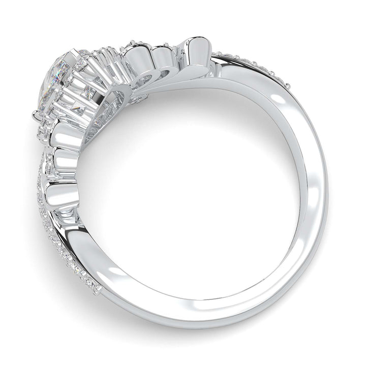 Pear-shaped diamond vintage engagement ring with custom prongs and halo design.