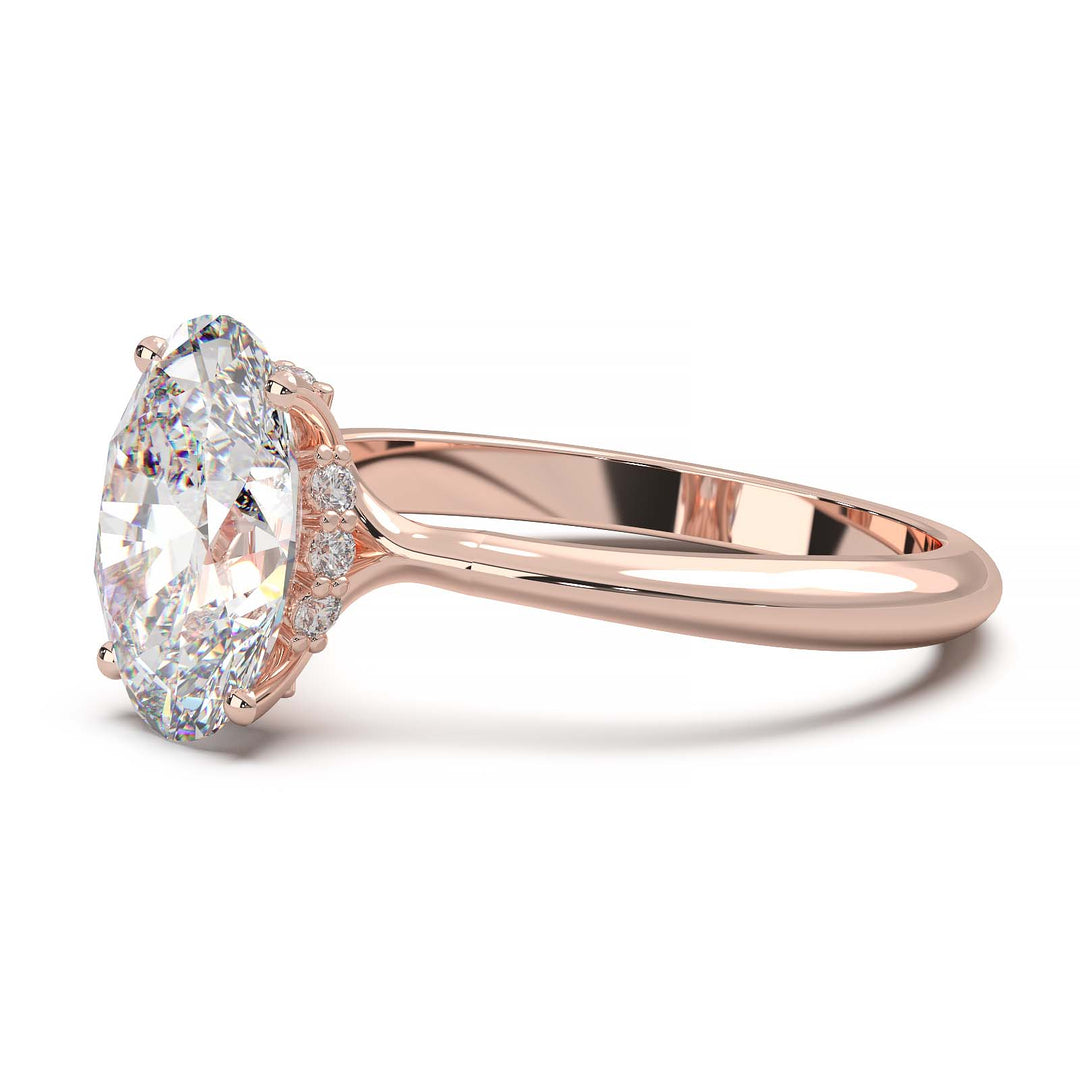 Oval lab-grown diamond ring with VVS1 clarity and D color, set in  gold with hidden halo.