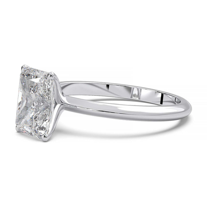 Radiant cut lab diamond solitaire ring with a low-profile setting and custom prongs.