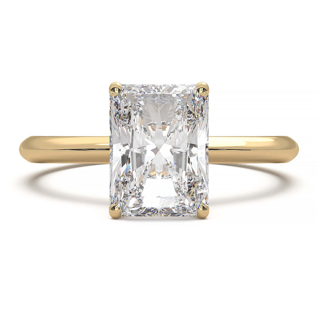 Radiant cut lab diamond solitaire ring with a low-profile setting and custom prongs.