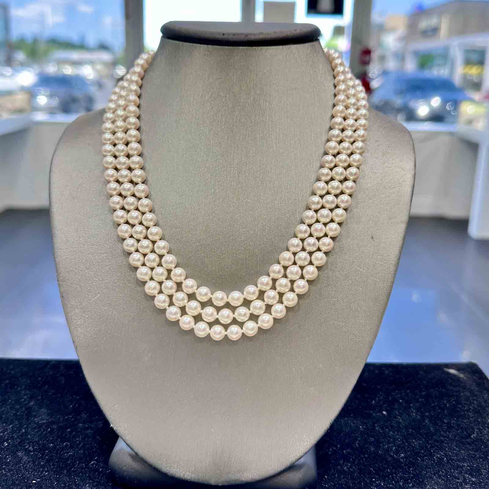 Three-strand Akoya cultured pearl necklace with 6.9-6.5mm AAA quality pearls and 14k clasp.