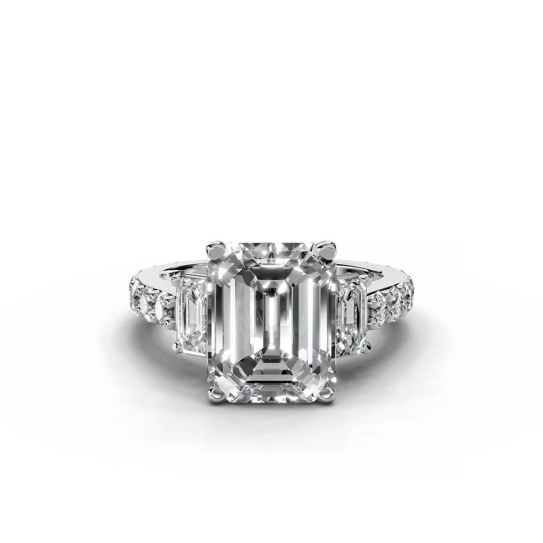 Emerald cut diamond three-stone engagement ring in white gold.