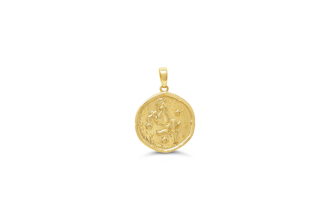 10K yellow gold Aries zodiac pendant with engraved ram design and star accents in a polished round medallion.