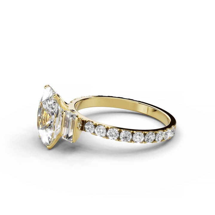 Cushion cut diamond engagement ring with baguette and round diamonds in yellow gold.