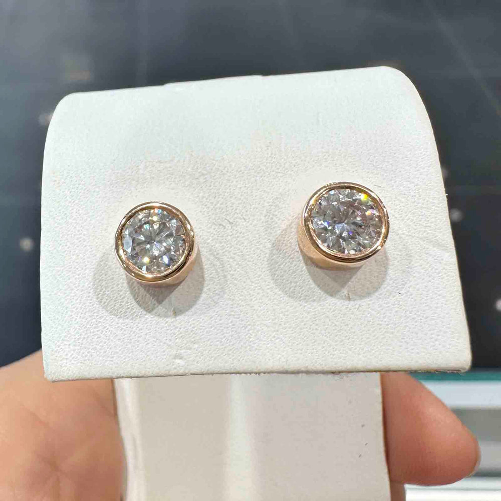 10K rose gold stud earrings with 6mm high-quality moissanite stones and strong butterfly backings, custom-made design.