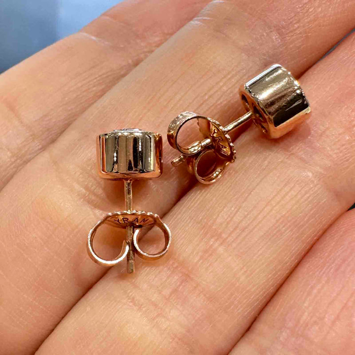 10K rose gold stud earrings with 6mm high-quality moissanite stones and strong butterfly backings, custom-made design.