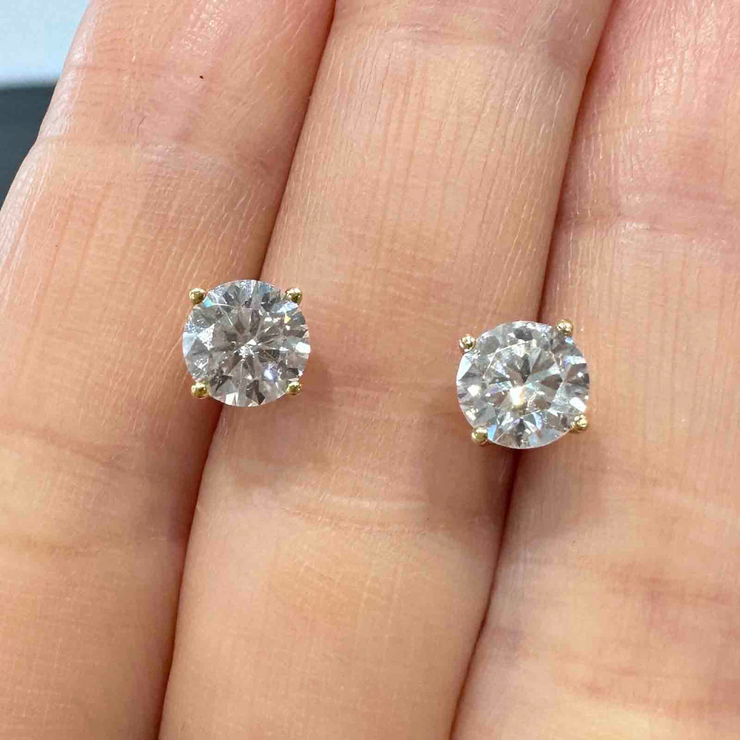 14K yellow gold stud earrings with 6mm colorless moissanite stones and secure screw-back closures, simple and elegant design.