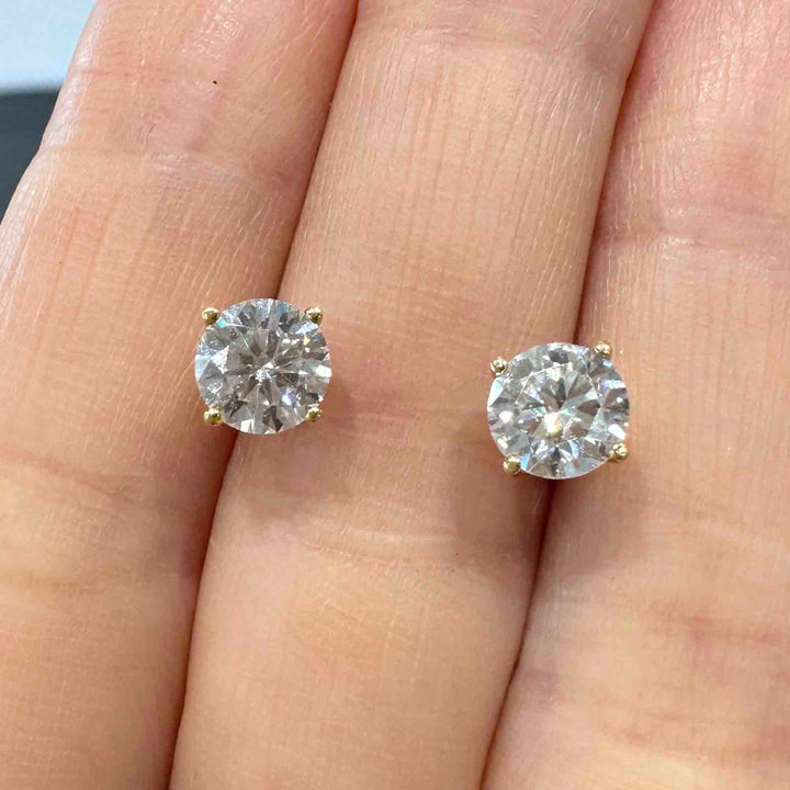 14K yellow gold stud earrings with 6mm colorless moissanite stones and secure screw-back closures, simple and elegant design.