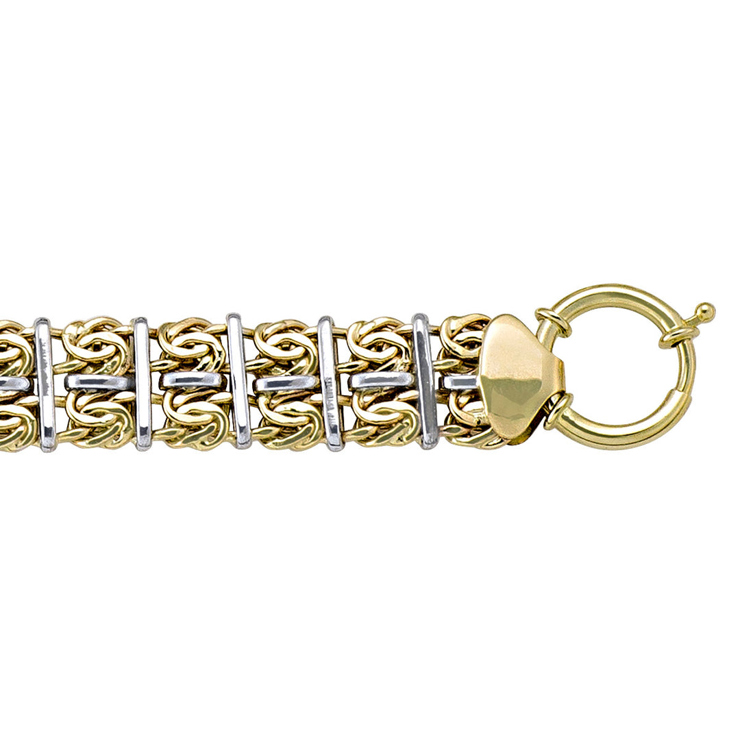 Stunning two-tone 10K gold bracelet featuring an elaborate hollow fancy design, blending yellow and white gold for a luxurious and eye-catching appearance.