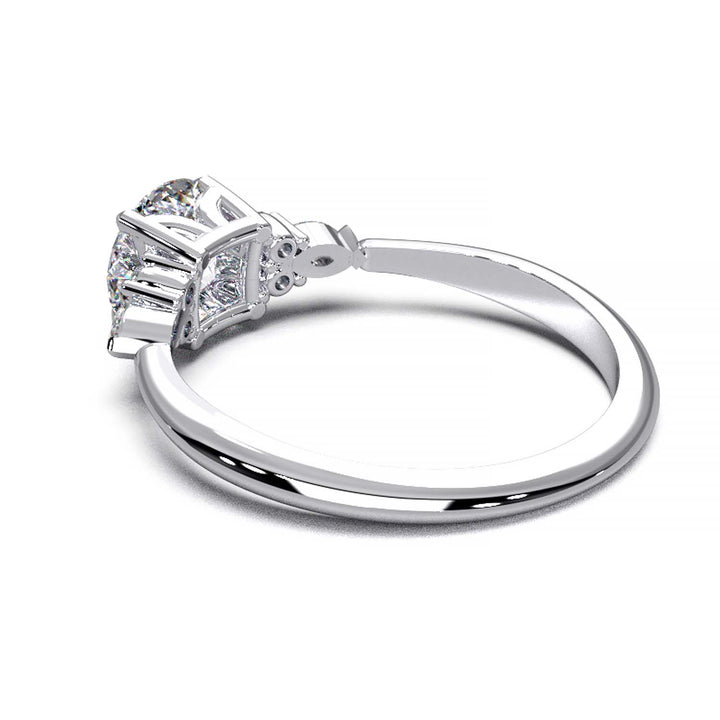 Elegant 0.6ct Round Lab-Grown Diamond Engagement Ring with Side Marquise and Round Accents.