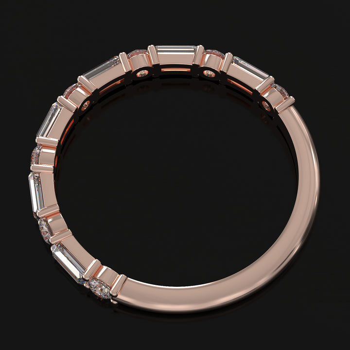 Lab-grown diamond wedding band with baguette and round stones in shared prong setting.