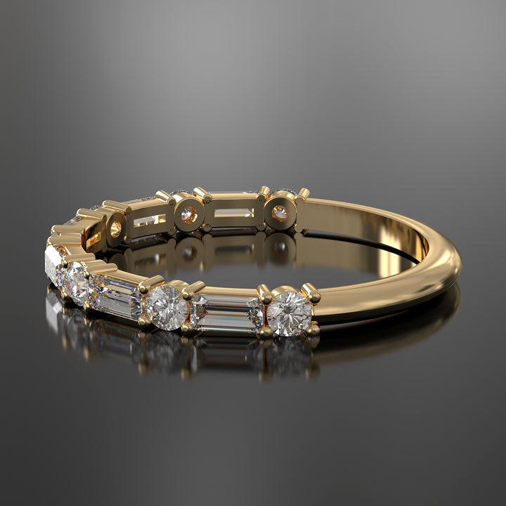 Lab-grown diamond wedding band with baguette and round stones in shared prong setting.