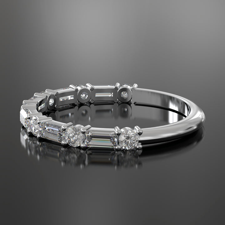Lab-grown diamond wedding band with baguette and round stones in shared prong setting.