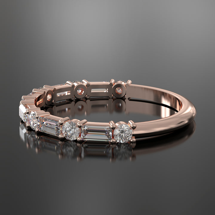 Lab-grown diamond wedding band with baguette and round stones in shared prong setting.