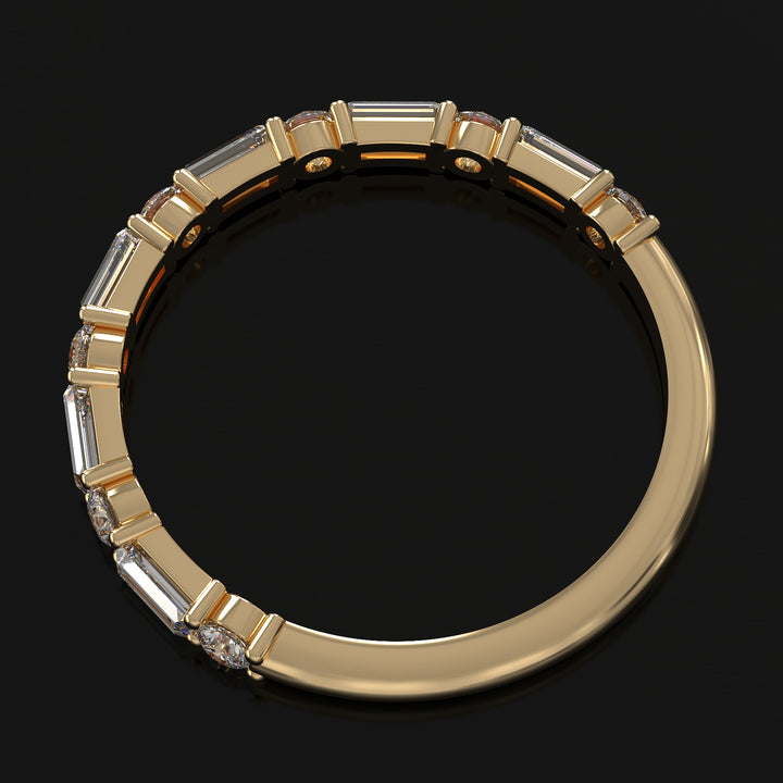 Lab-grown diamond wedding band with baguette and round stones in shared prong setting.
