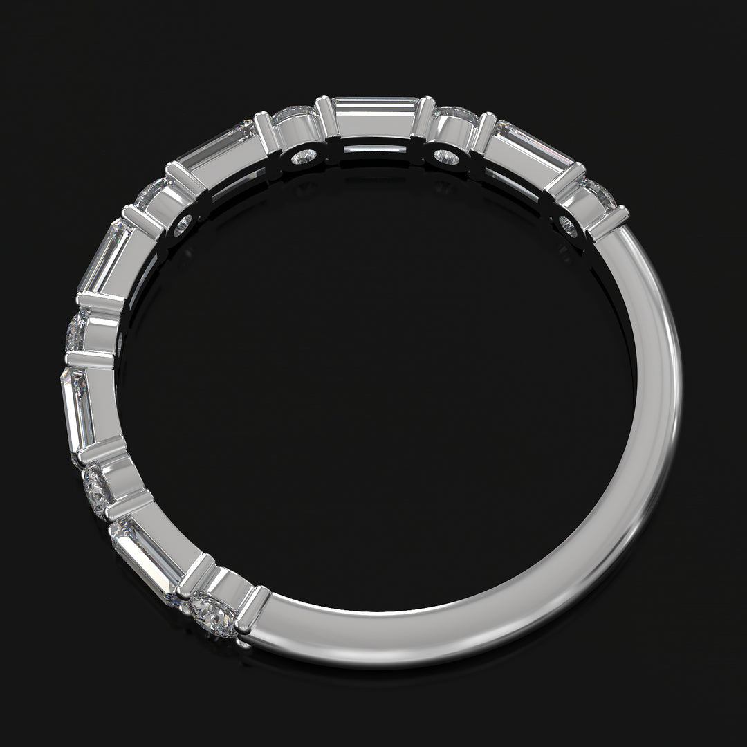 Lab-grown diamond wedding band with baguette and round stones in shared prong setting.