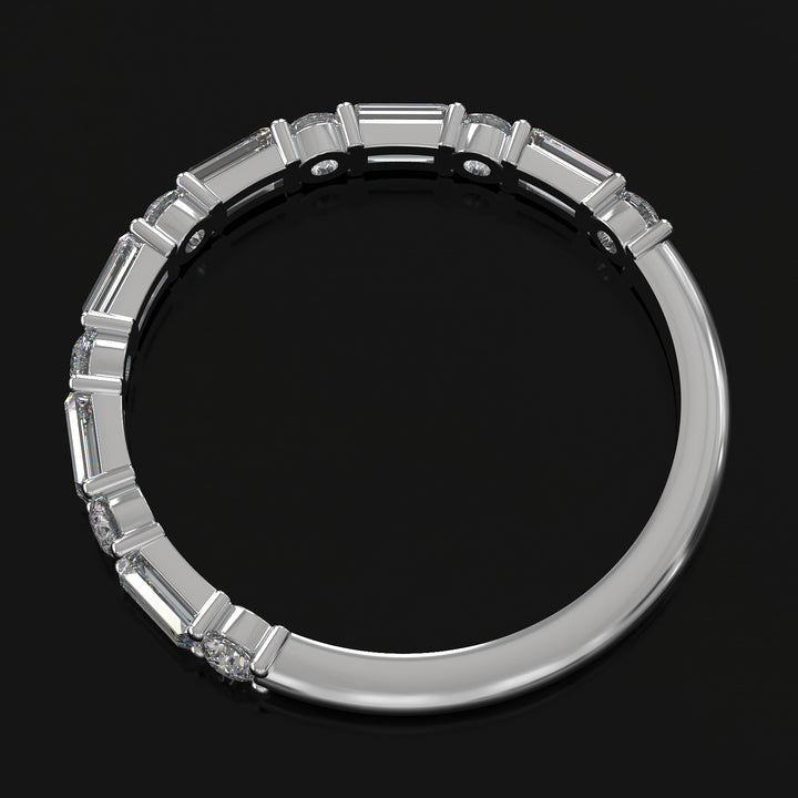 Lab-grown diamond wedding band with baguette and round stones in shared prong setting.
