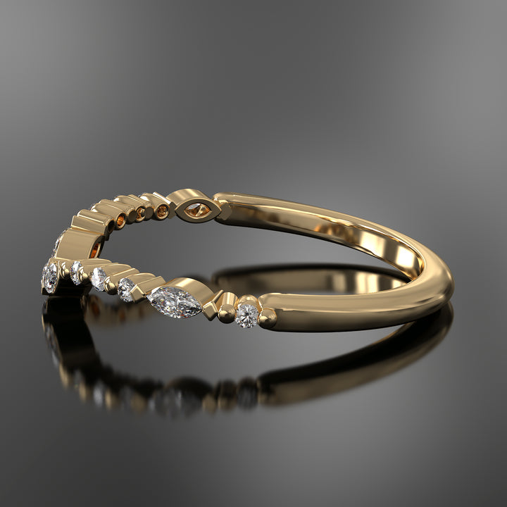 Curved wedding band with marquise and round lab-grown diamonds in a floating design with shared prongs.